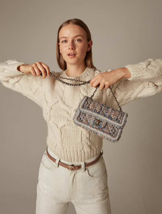 Woman with a popular luxury designer handbag